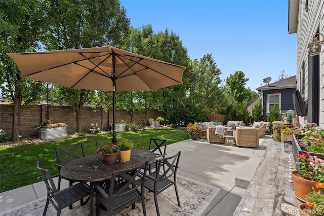 7853 S Jasper Way, Englewood, CO 80112 - fenced backyard featuring outdoor lounge area, outdoor dining space, and a patio