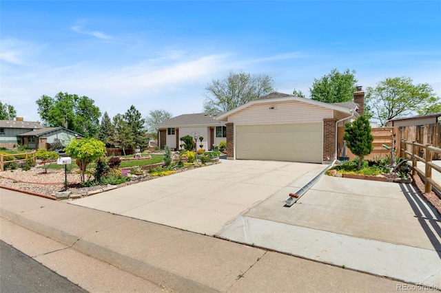 7260 Otis Ct, Arvada, CO 80003 - ranch-style home with an attached garage, brick siding, driveway, and a chimney