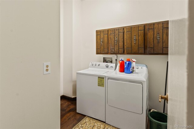 7260 Otis Ct, Arvada, CO 80003 - washroom with washer and dryer, cabinet space, and dark wood-style flooring
