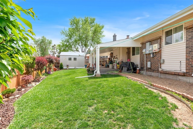 7260 Otis Ct, Arvada, CO 80003 - view of yard featuring an outbuilding and a patio area