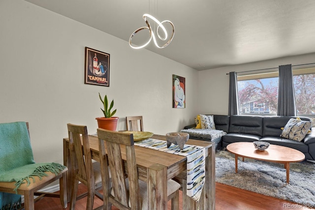 interior space featuring an inviting chandelier and wood finished floors