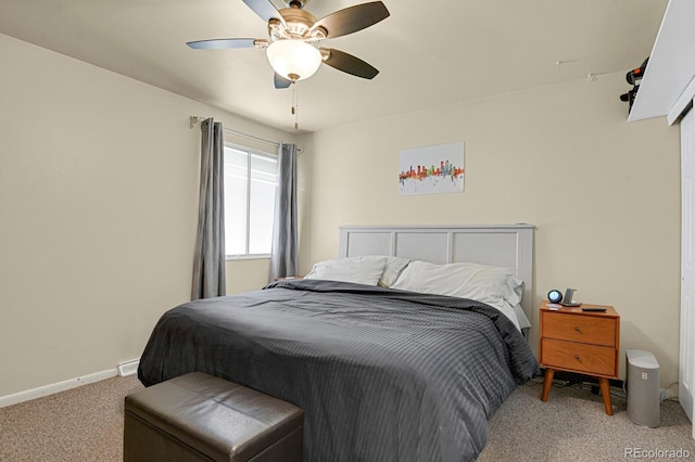 bedroom featuring baseboards, ceiling fan, and light colored carpet