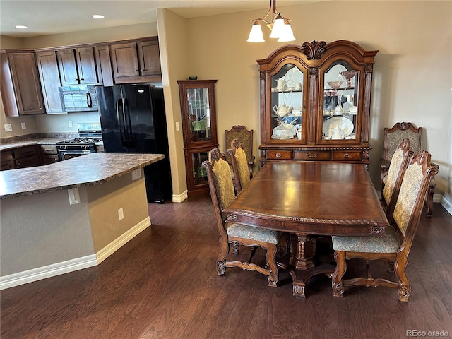 4746 Raven Run, Broomfield, CO 80023 - dining room featuring dark wood-style flooring, baseboards, a chandelier, and recessed lighting