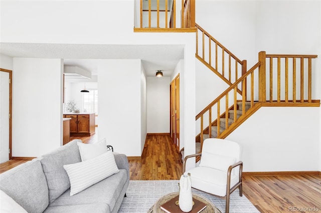 2040 S Xenia Way, Denver, CO 80231 - living room featuring wood finished floors and stairs