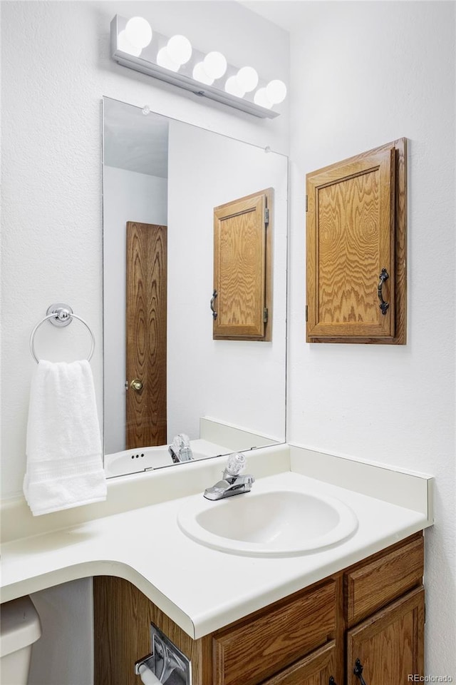 2040 S Xenia Way, Denver, CO 80231 - bathroom featuring vanity and toilet