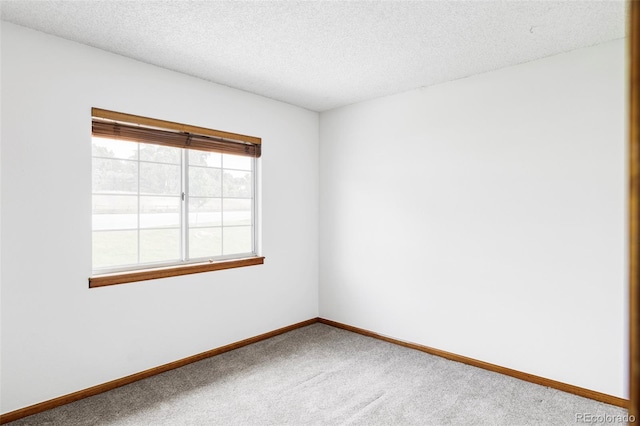 2040 S Xenia Way, Denver, CO 80231 - carpeted empty room with a textured ceiling and baseboards