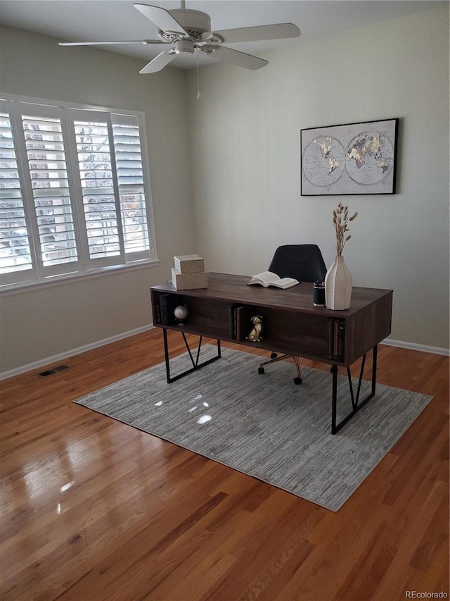 office space with hardwood / wood-style flooring and ceiling fan