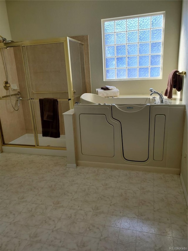 bathroom with a shower with shower door