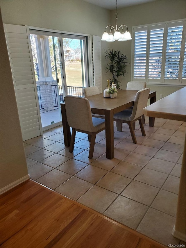 dining room featuring an inviting chandelier and light hardwood / wood-style floors