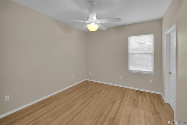 unfurnished room featuring ceiling fan and light hardwood / wood-style flooring