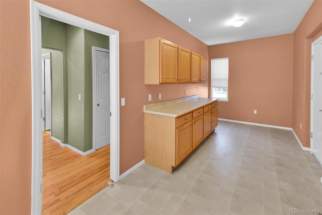 kitchen featuring light brown cabinetry