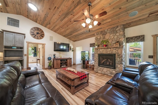 living room with visible vents, wooden ceiling, light wood-style flooring, and a ceiling fan