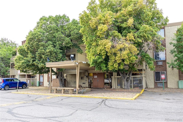 1302 S Parker Rd Unit 134, Denver, CO 80231 - view of front facade with uncovered parking