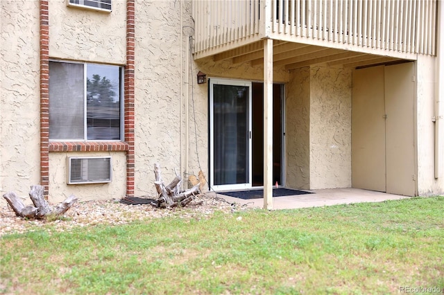 1302 S Parker Rd Unit 134, Denver, CO 80231 - doorway to property with a yard and stucco siding
