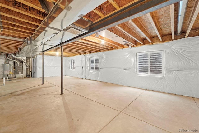 basement with gas water heater and heating unit