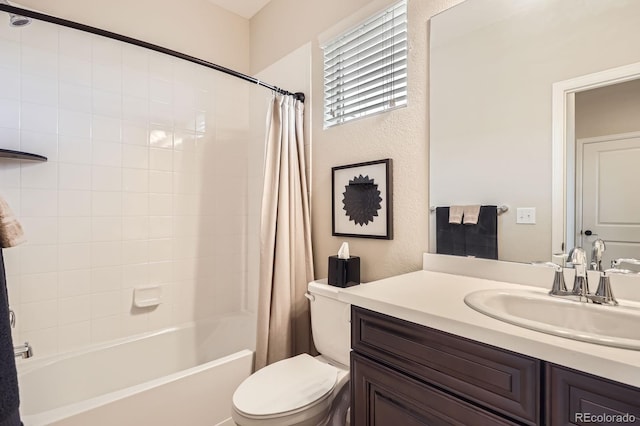 bathroom featuring toilet, shower / bath combo, and vanity