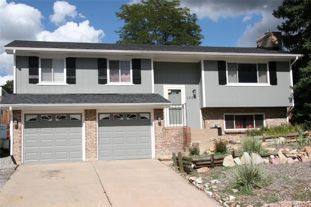 1008 Park View Ct, Castle Rock, CO 80104 - raised ranch with brick siding, driveway, a chimney, and an attached garage