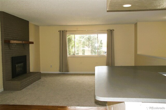 1008 Park View Ct, Castle Rock, CO 80104 - carpeted living room with a fireplace, baseboards, a textured ceiling, and recessed lighting