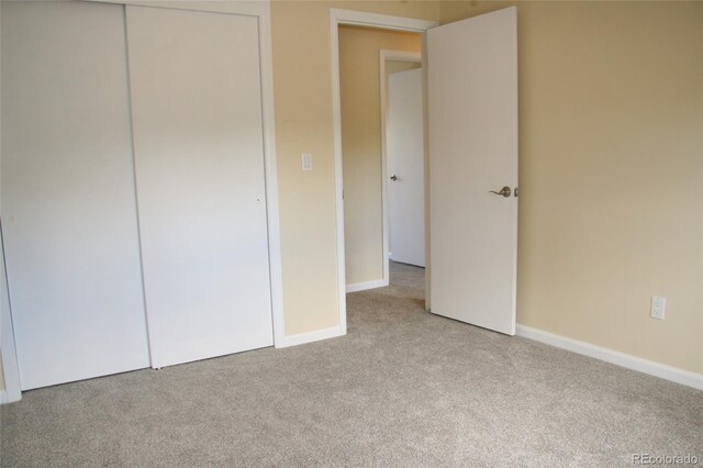 1008 Park View Ct, Castle Rock, CO 80104 - unfurnished bedroom with light carpet, baseboards, and a closet