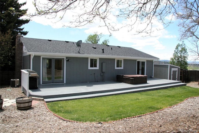 1008 Park View Ct, Castle Rock, CO 80104 - back of house featuring a covered hot tub, a wooden deck, central AC, and a storage unit