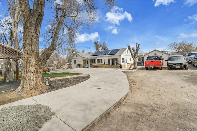 7060 Holly St, Commerce City, CO 80022 - view of front of house with driveway and solar panels