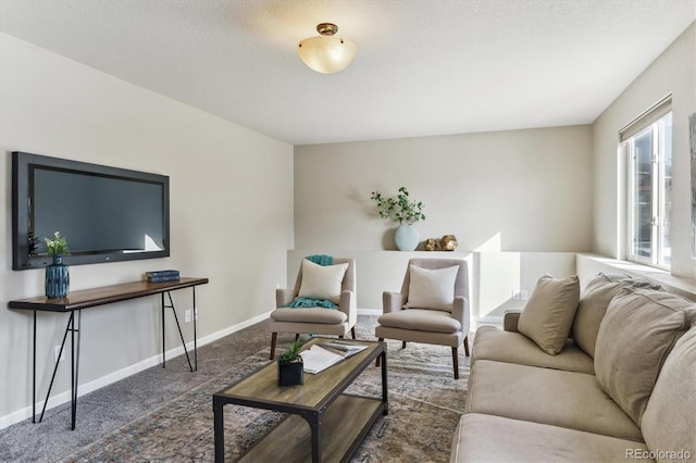 living room with a textured ceiling and dark colored carpet