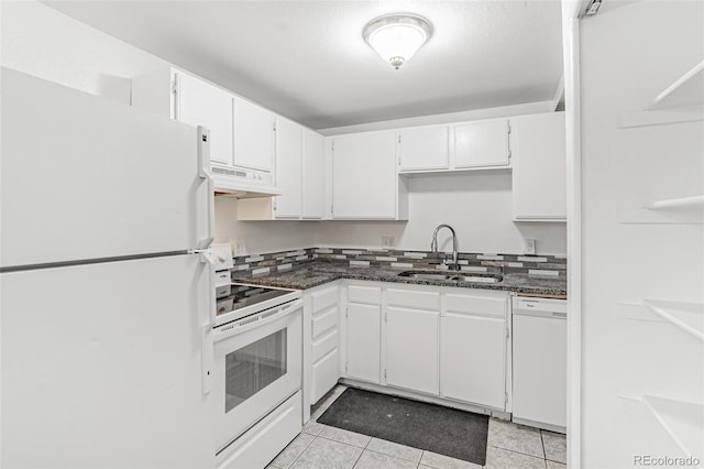 kitchen featuring white cabinets, custom range hood, sink, and white appliances