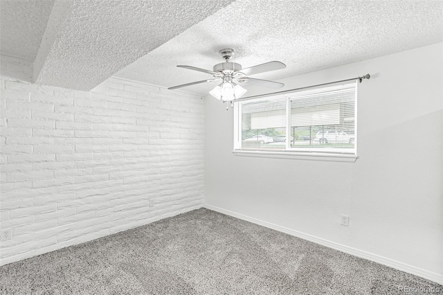 empty room with a textured ceiling, carpet, and ceiling fan