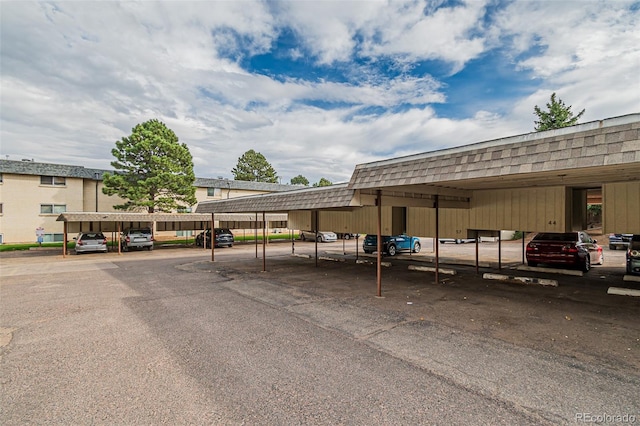 view of vehicle parking with a carport