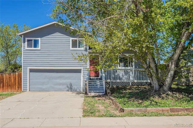 view of front of property with a porch and a garage