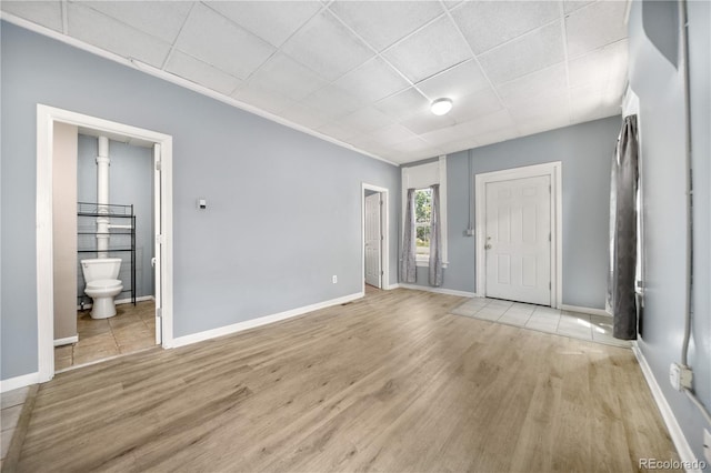 741 Mariposa St, Denver, CO 80204 - entryway featuring light wood-type flooring, baseboards, and a paneled ceiling