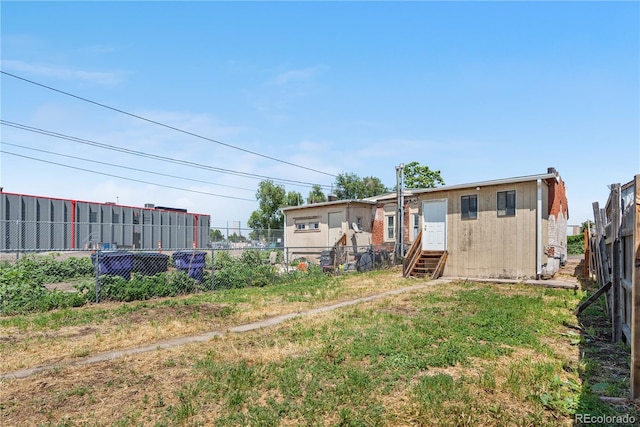 741 Mariposa St, Denver, CO 80204 - back of house featuring entry steps and a fenced backyard