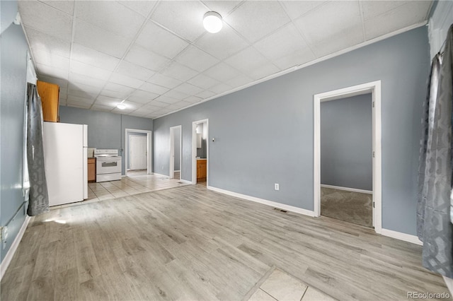 741 Mariposa St, Denver, CO 80204 - unfurnished living room featuring light wood-style floors, baseboards, a drop ceiling, and ornamental molding