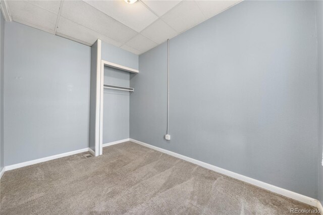 741 Mariposa St, Denver, CO 80204 - unfurnished bedroom featuring carpet flooring, a closet, a drop ceiling, and baseboards