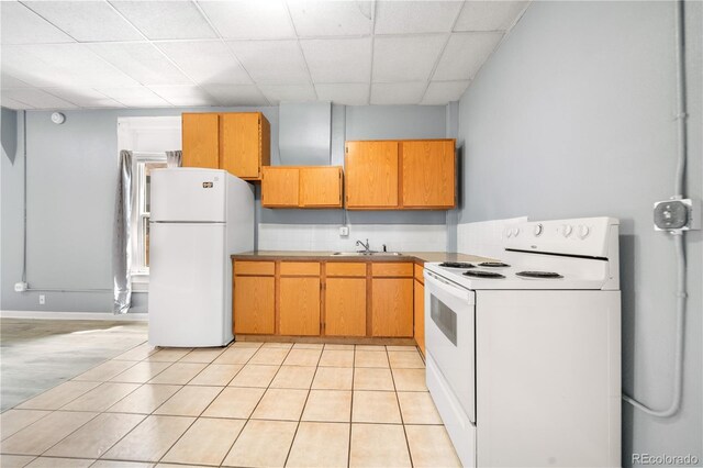 741 Mariposa St, Denver, CO 80204 - kitchen with white appliances, a paneled ceiling, light tile patterned flooring, a sink, and light countertops