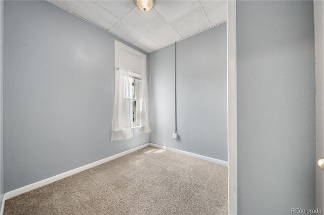 741 Mariposa St, Denver, CO 80204 - carpeted empty room featuring baseboards and a drop ceiling