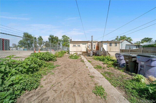 741 Mariposa St, Denver, CO 80204 - rear view of property with entry steps
