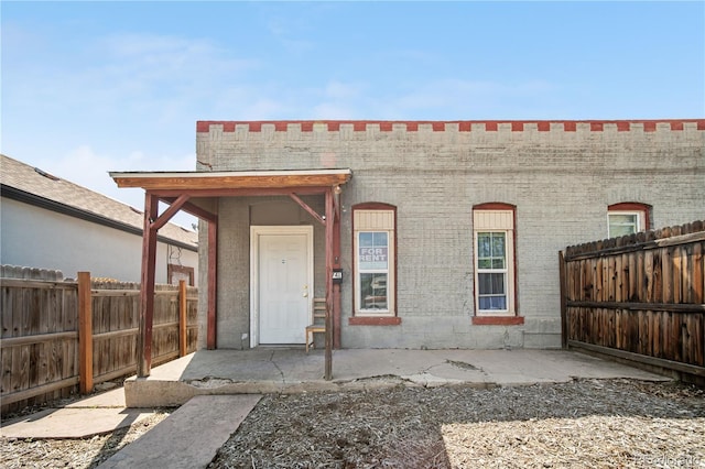 741 Mariposa St, Denver, CO 80204 - back of property with brick siding and a fenced backyard