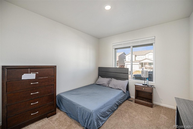 bedroom with light colored carpet