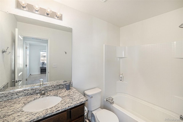 full bathroom with vanity,  shower combination, and toilet