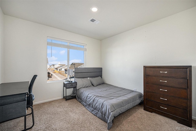 bedroom featuring light carpet