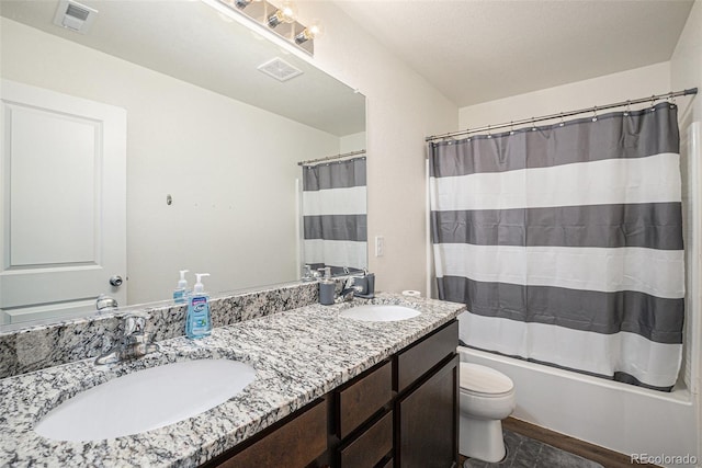 full bathroom featuring shower / tub combo, vanity, toilet, and tile patterned floors