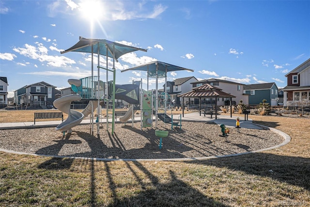 view of play area featuring a gazebo and a lawn