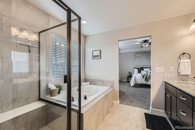 bathroom with a shower stall, ensuite bath, a bath, vanity, and ceiling fan
