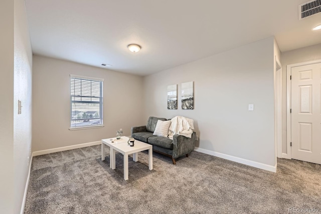 sitting room with carpet and baseboards