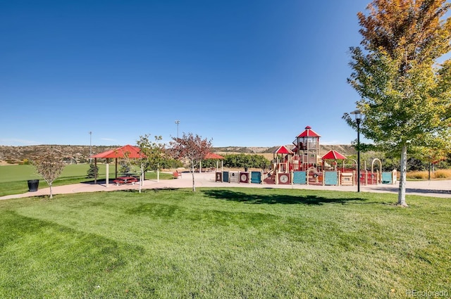 community jungle gym featuring a gazebo and a lawn
