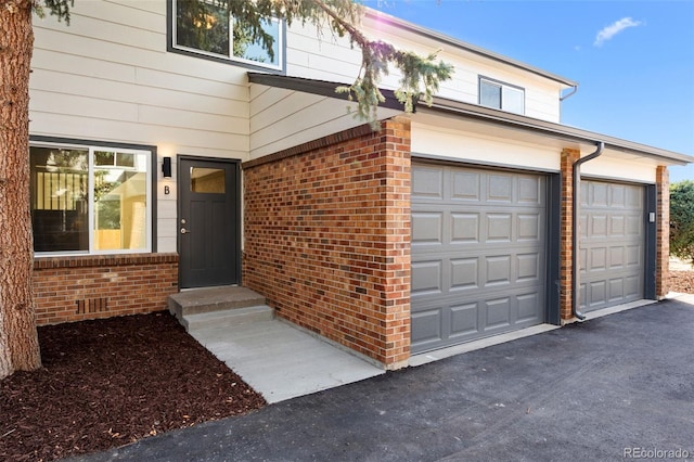 property entrance featuring a garage