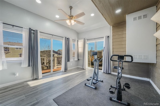 exercise room with ceiling fan and hardwood / wood-style flooring