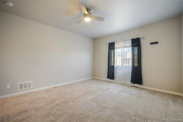 unfurnished room with carpet and ceiling fan