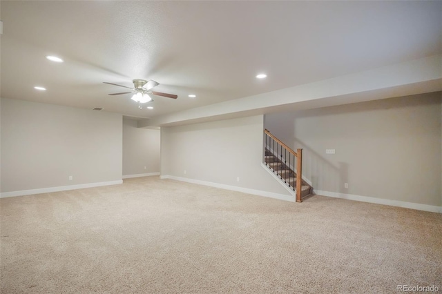 interior space with light carpet and ceiling fan